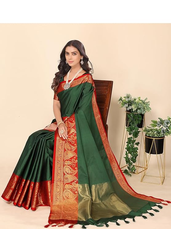 Experience a luxurious blend of jacquard cotton and silk with this Indian Banarasi saree. Woven with a solid design, golden zari border and running blouse piece,