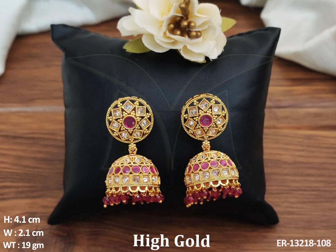 Expertly crafted from brass metal, these Fancy Designer Jhumka Earrings feature a luxurious High Gold Polish for a sophisticated look.