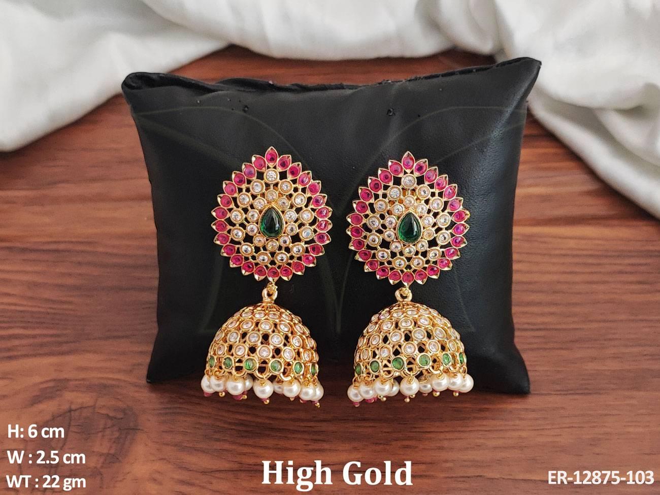 The High Gold Polish Party Wear Kemp Jewelry Accessories Fancy Jhumka Earrings Set is crafted with brass metal and boasts a high gold polish for a luxurious look.