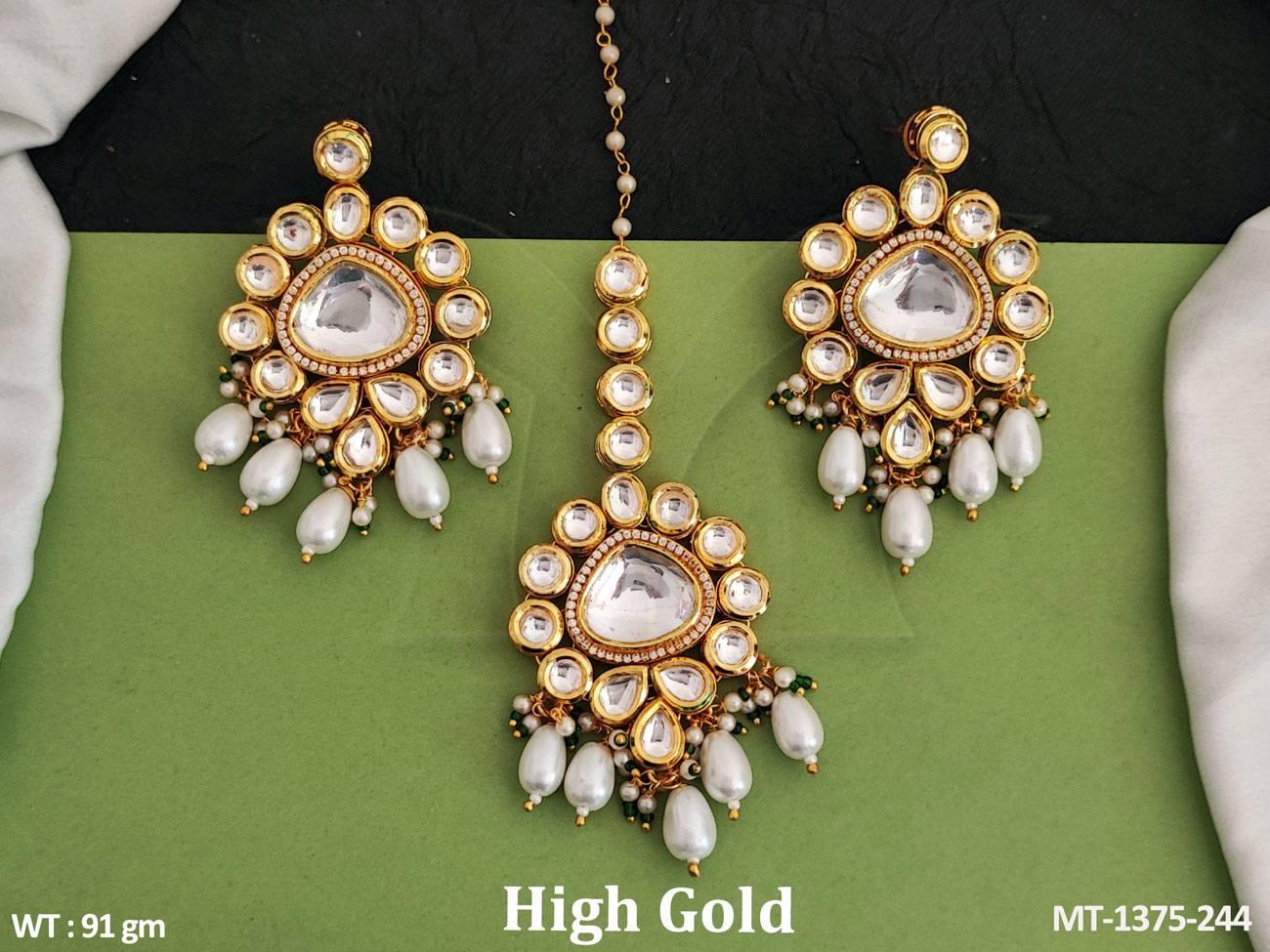 Elevate your ensemble with our Clustered Pearl High Gold Polish Maang Tikka and Earring set.