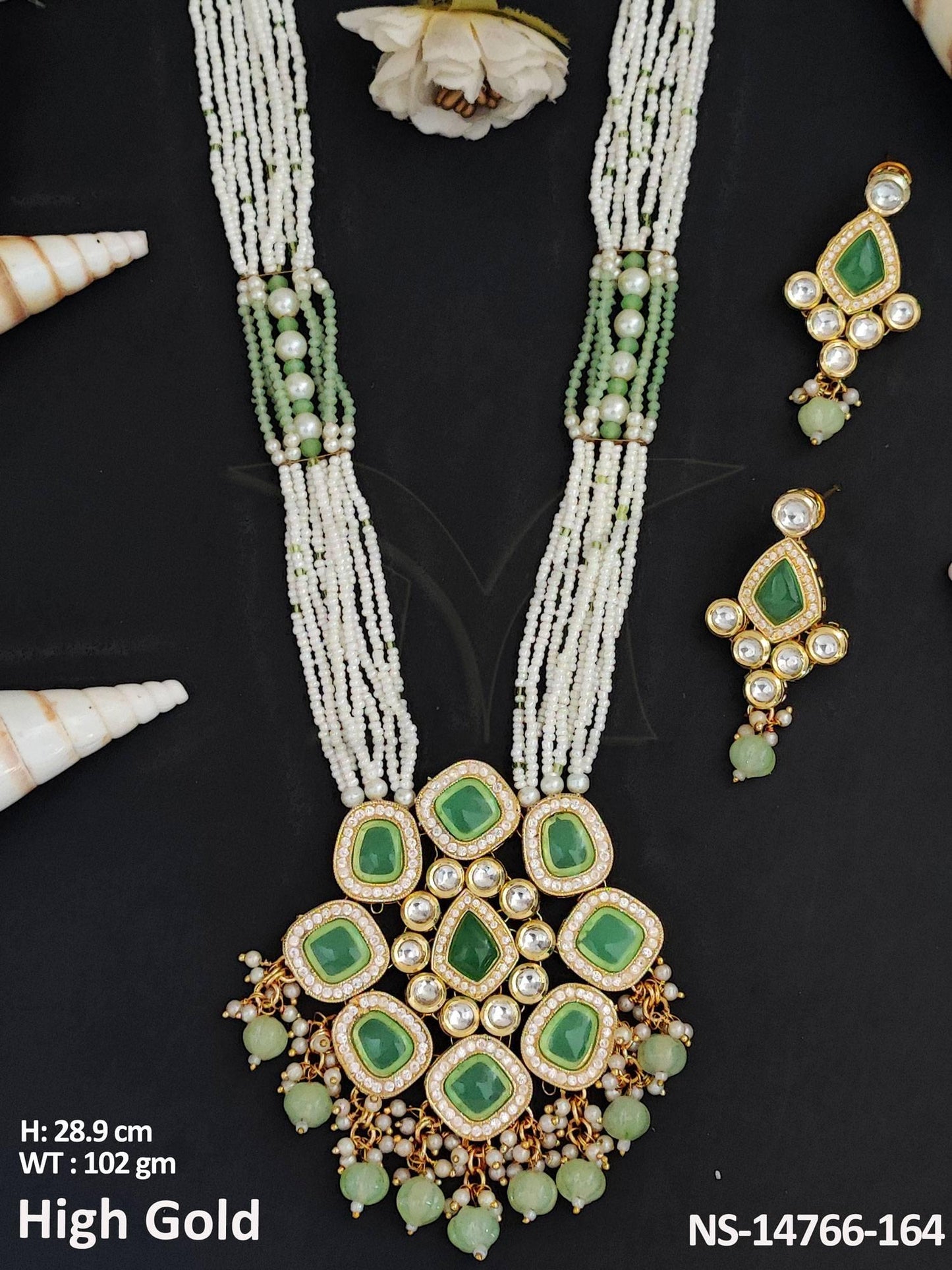 This Kundan Jewellery set features a fancy long necklace with high gold polish, crafted from brass metal.