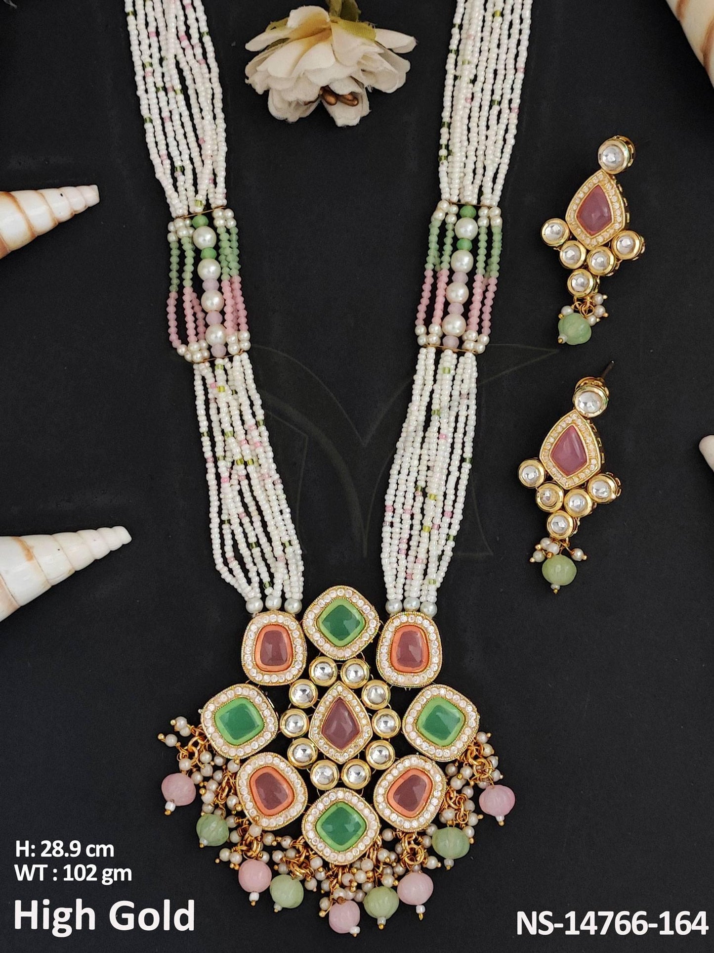 This Kundan Jewellery set features a fancy long necklace with high gold polish, crafted from brass metal.