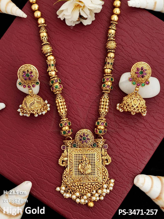 Expertly crafted, this designer pendant set showcases intricate temple-inspired details.
