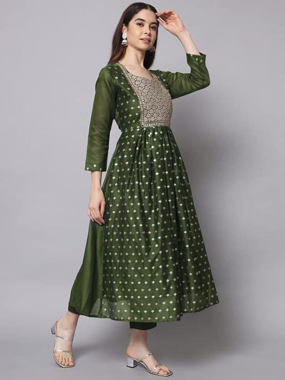 traditional ensemble is designed to flatter any figure. Embroidered detailing adds an elegant touch to this look.