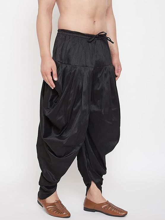 Feel fashionably chic wearing this stylish cowl pattern dhoti for men made with a silk blend fabric.