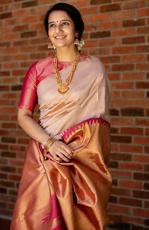 stunning combination of Banarasi Soft Lichi Silk and Kanjivaram Silk.t comes with a soft Lichi Silk blouse piece for a traditional, elegant look.