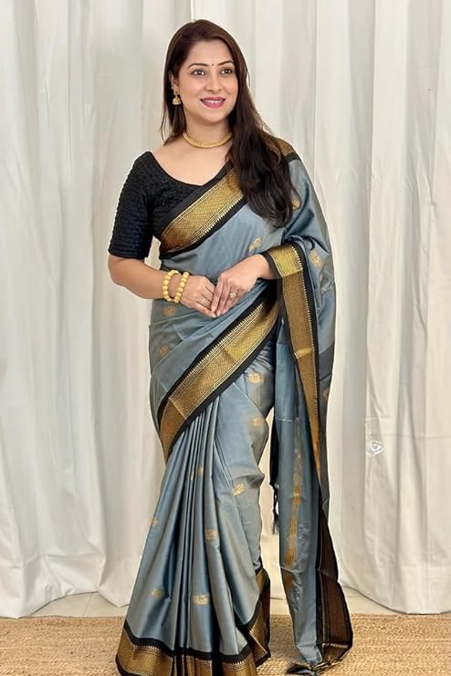 This elegant Kanjivaram saree is crafted from the finest lichi silk for a luxurious look and feel. The traditional weave and exclusive motifs create a timeless aesthetic.