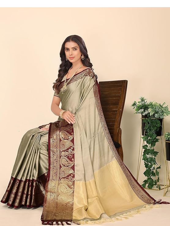 saree is an exquisite blend of Jacquard Cotton and Silk, with a plain solid design and golden zari border.