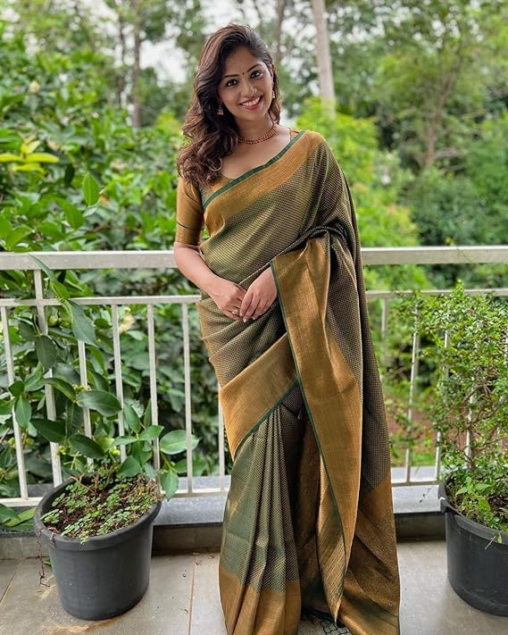 Perfect for special occasions, this saree will make an eye-catching statement at any event.smooth texture and intricate Zari designs