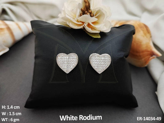 These Heart Shape Full Stone Designer Wear White Rodium Polish AD Tops Studs Earrings add an elegant touch to any outfit.