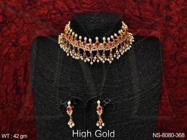 This stunning choker style necklace set features a cluster of white CZ and AD stones, perfectly complementing the beautiful pearls.