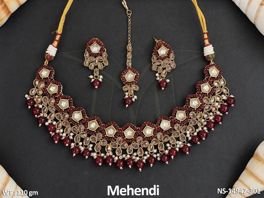 Expertly crafted from brass metal, this Short Necklace Set features an antique design with intricate Mehendi Polish.