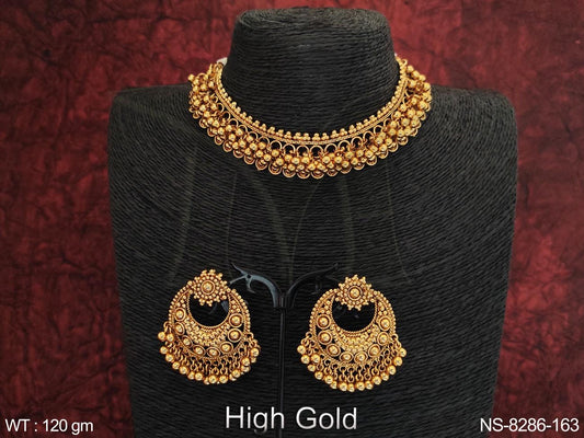 This elegant antique designer necklace set boasts a high gold polish and choker style, perfect for making a statement at any party or special occasion.