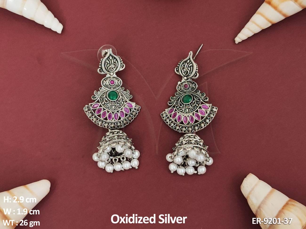 Experience the timeless charm and sophistication of these designer earrings.