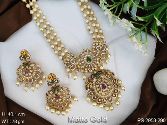 This trendy pendant set is designed with clustered pearls and a matte gold finish, perfect for any special occasion. Showcase your style with this eye-catching piece of jewellery.