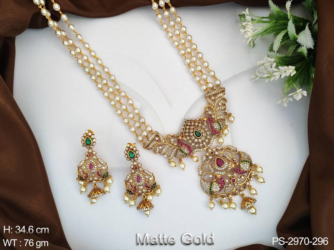 Crafted from matte gold with a fancy design, this pendant set will be sure to make any look shine.