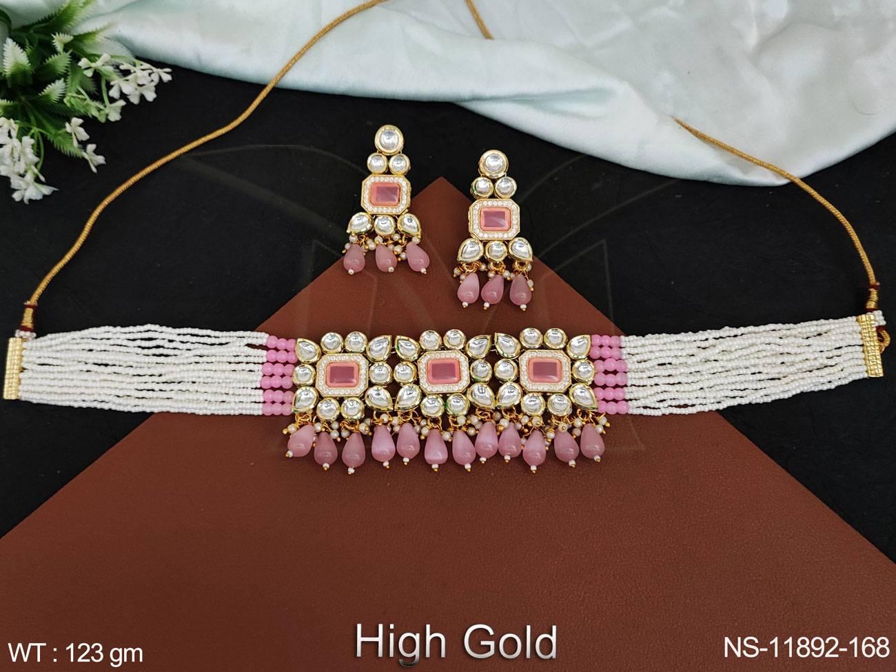 The intricate Kundan stones add a touch of opulence. Elevate your look with this stunning necklace set.