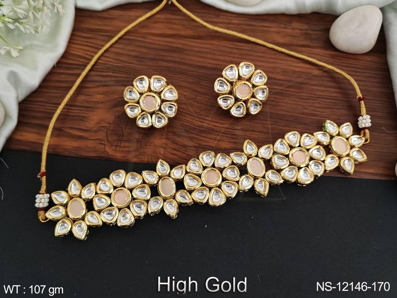 This choker style necklace set features intricate fancy designs and stunning Kundan stones to add a touch of elegance to any outfit.