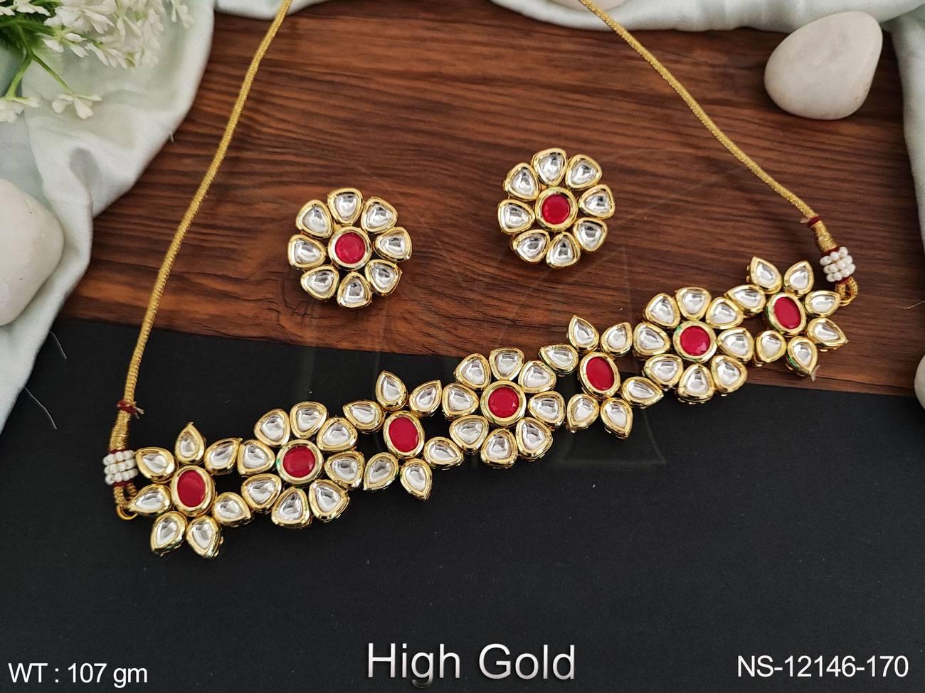 This choker style necklace set features intricate fancy designs and stunning Kundan stones to add a touch of elegance to any outfit.