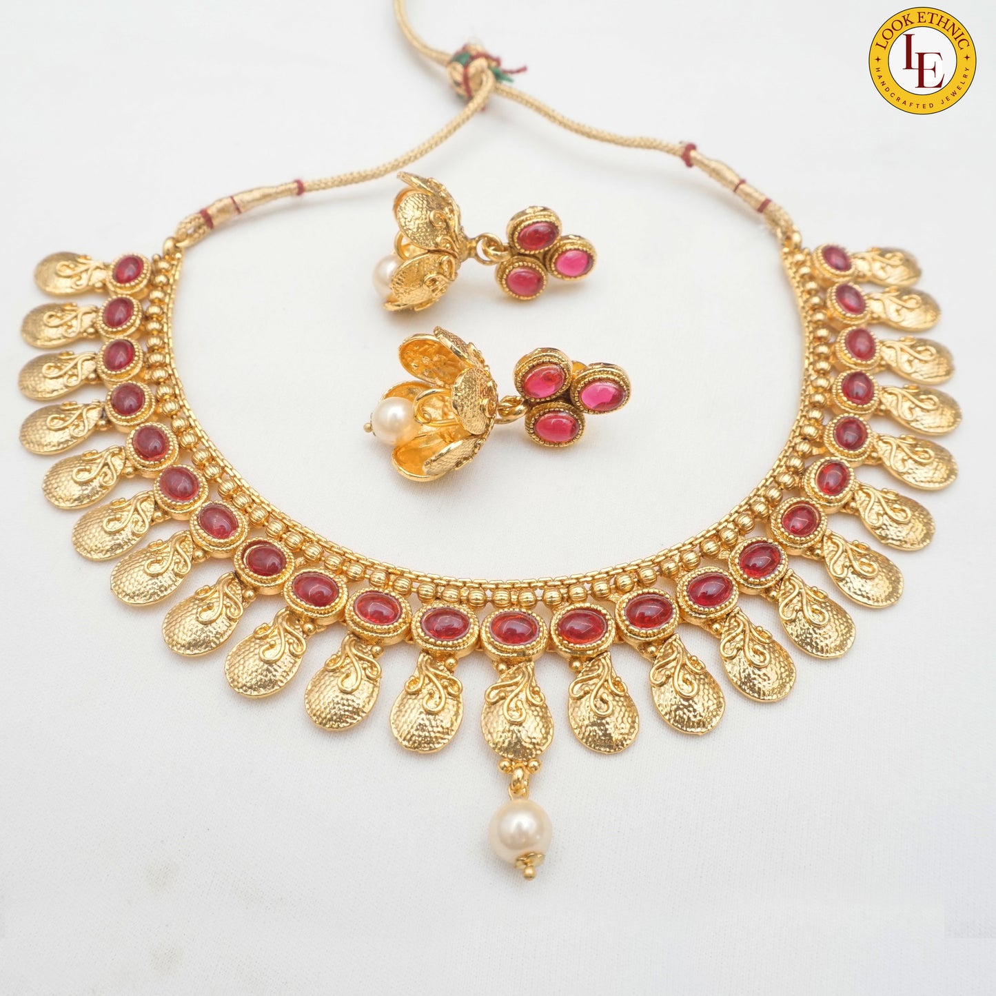 Bring a touch of elegance to your outfit with our Gold Plated Short Necklace Set