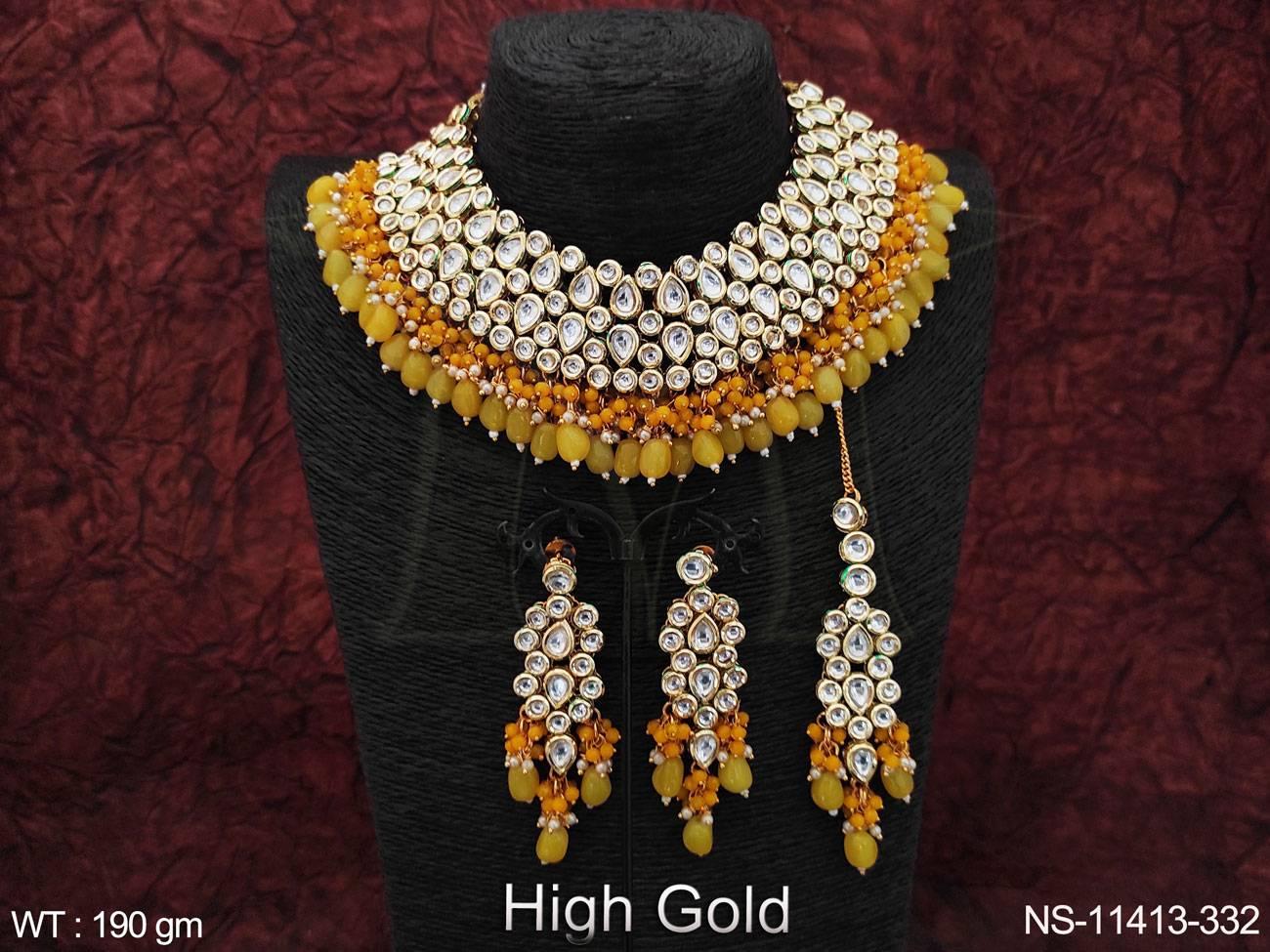 Crafted with high-quality Kundan stones and featuring a stunning high gold polish, this choker necklace set is the perfect addition to your party wear collection.