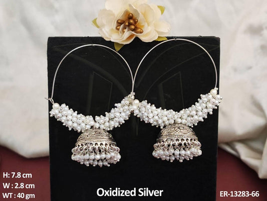 Upgrade your party look with these elegant Oxidized Silver Polish Cluster Pearl Jhumka Earrings.