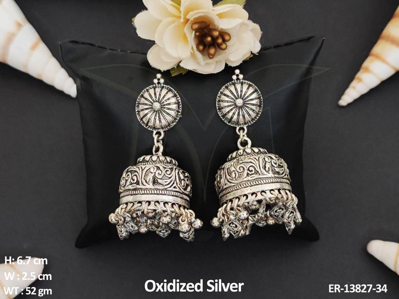 Expertly designed, these Oxidised Silver Polish Jhumka Earrings add a touch of antique charm to any party outfit.