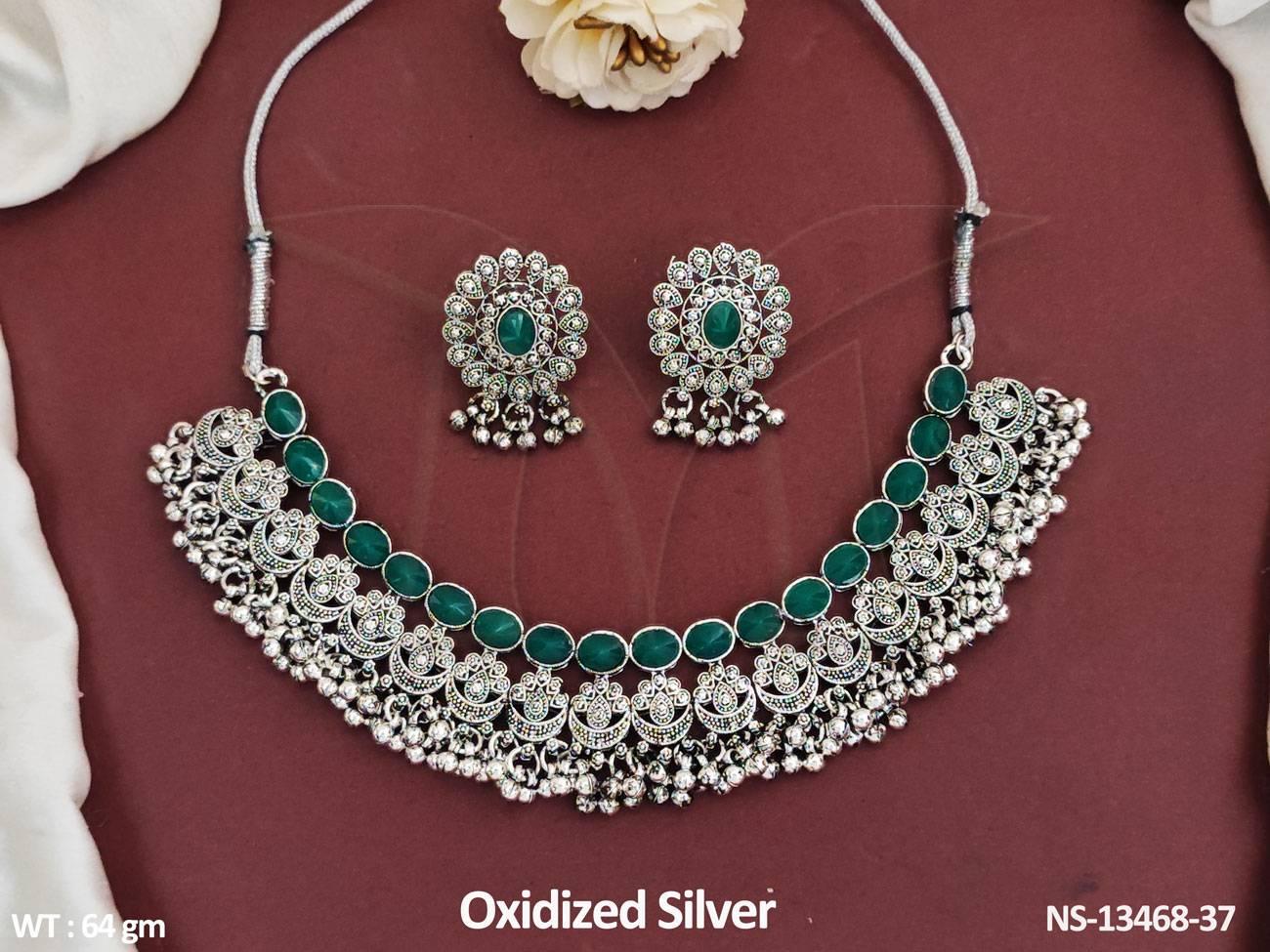 oxidized jewellery set boasts a beautiful design that is perfect for any party. Its elegant and intricate details add a touch of sophistication to any outfit.