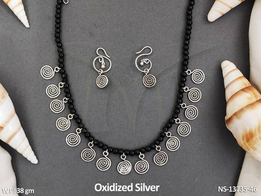 This antique design oxidised silver polish necklace set features a beautiful fancy style, making it perfect for parties. Made with high-quality materials,