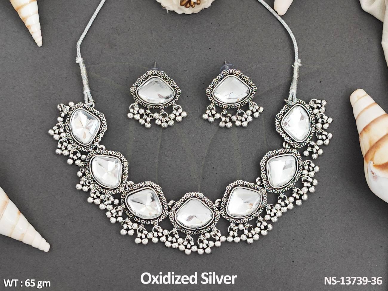 Elevate any outfit with this beautifully crafted Designer Short Necklace Set. The fancy oxidised polish adds a touch of elegance, making it the perfect accessory for parties.
