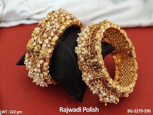 Experience the timeless elegance and grace of our Fancy Design Clustered Pearl Rajwadi Polish Temple Bangle Set