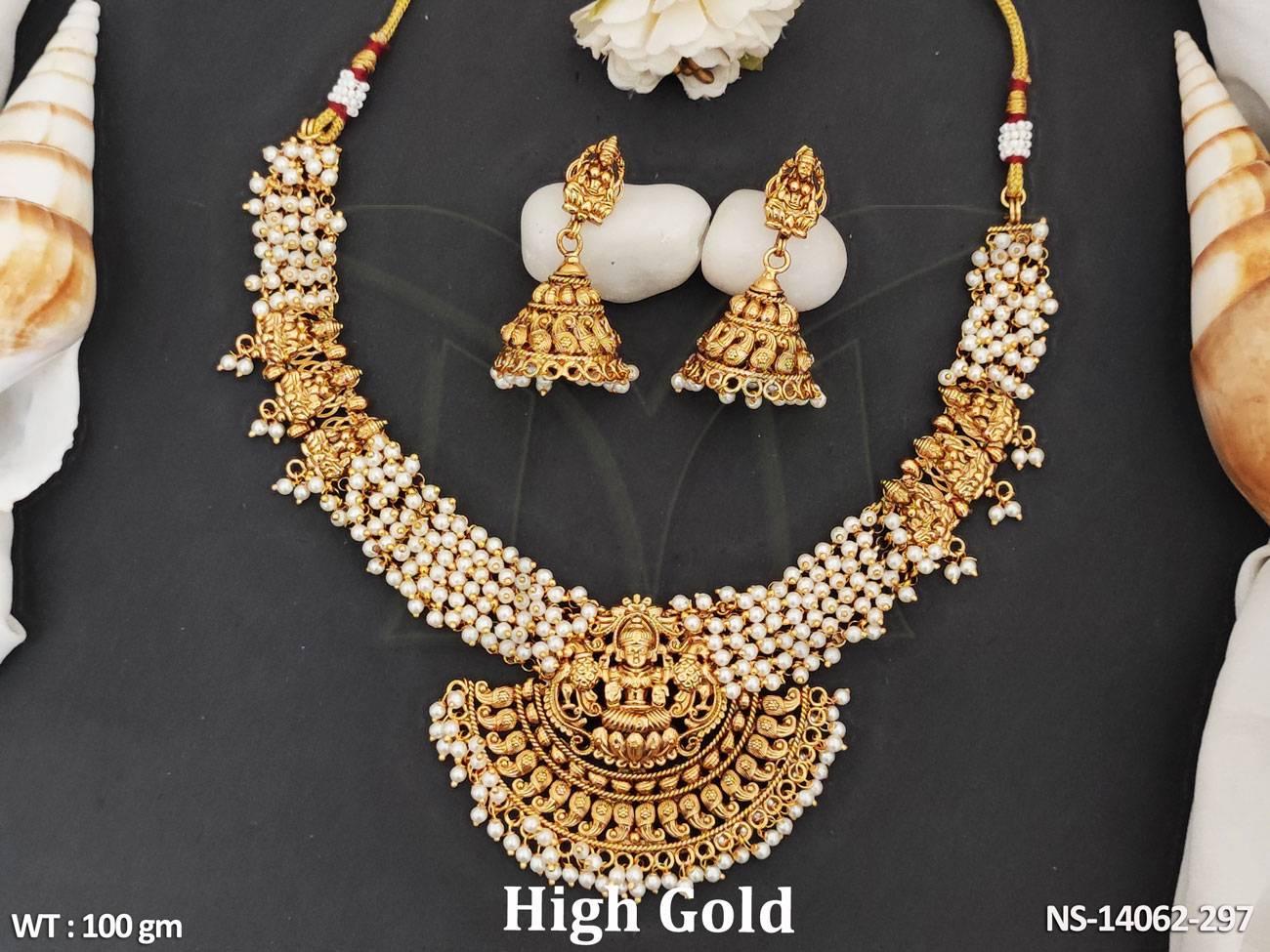Designer necklace set features a Laxmi pendant with clustered pearls and high-quality gold polish for a luxurious look.