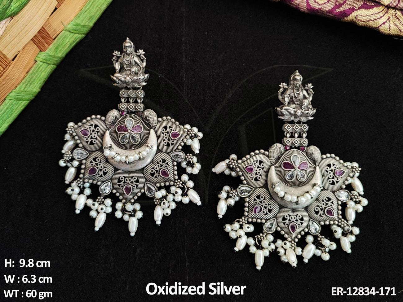 Expertly crafted for the discerning bride, these wedding wear oxidized dangler earrings will add elegance and drama to any bridal ensemble.