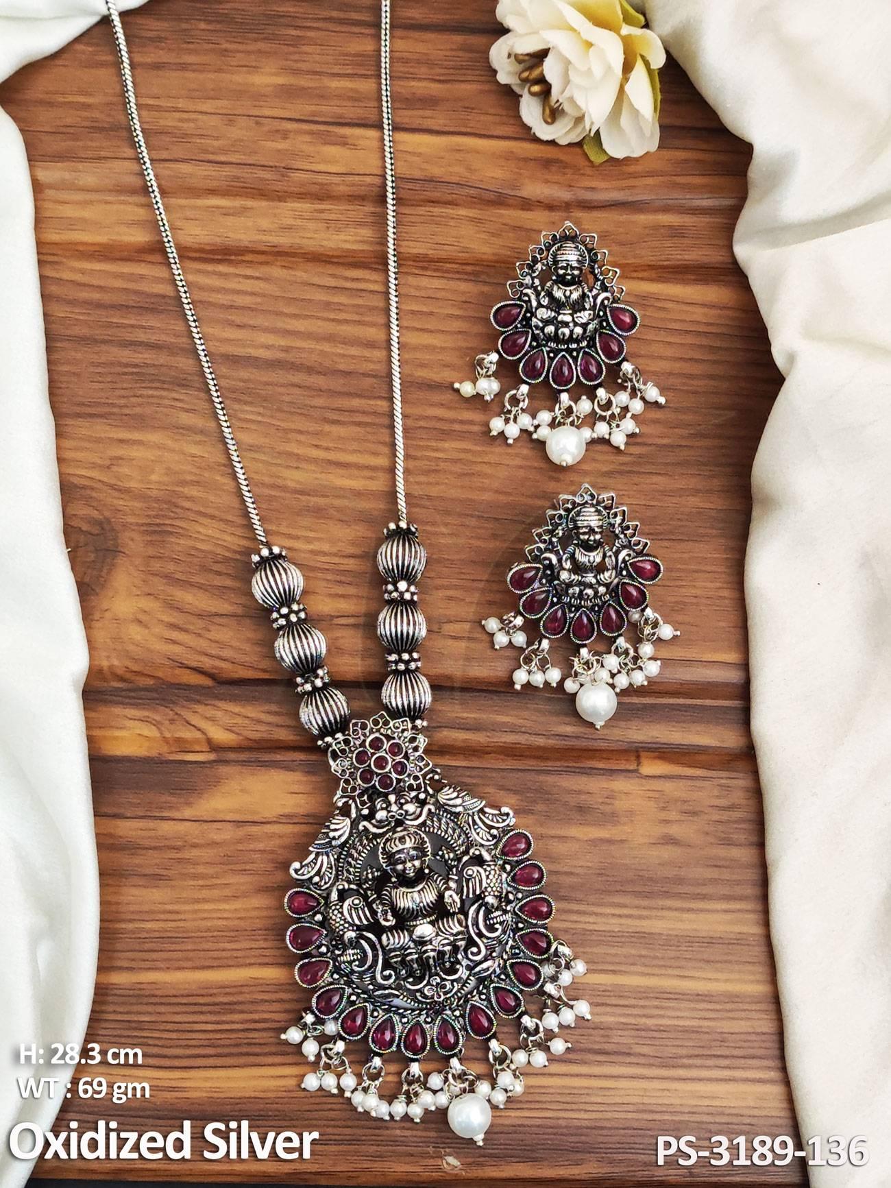 Achieve a touch of elegance with our Clustered Pearl Oxidised Silver Temple Pendant Set. Crafted with intricate details and polished to antique perfection,