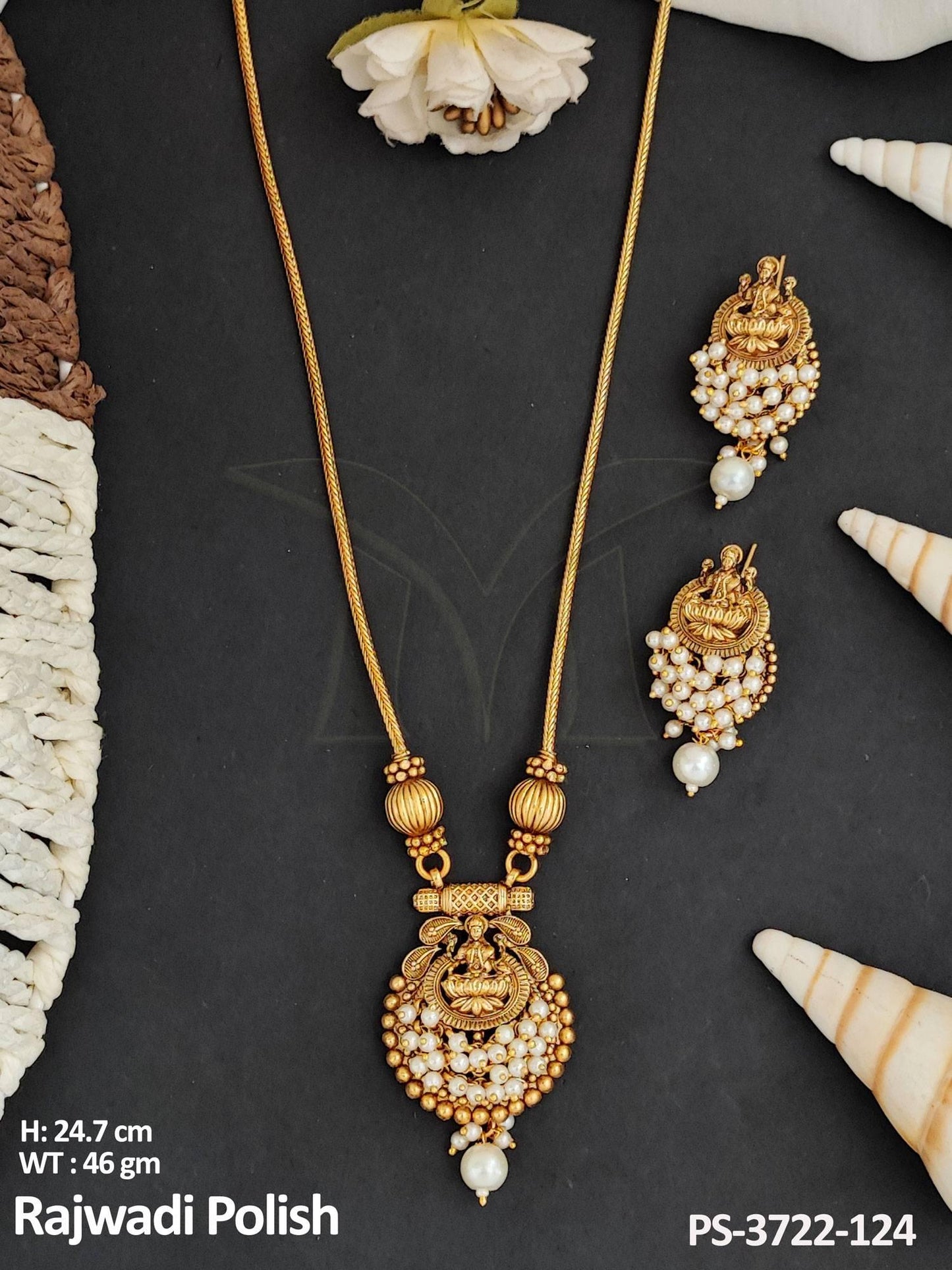 This exquisite Temple Jewellery pendant set boasts a traditional God face design