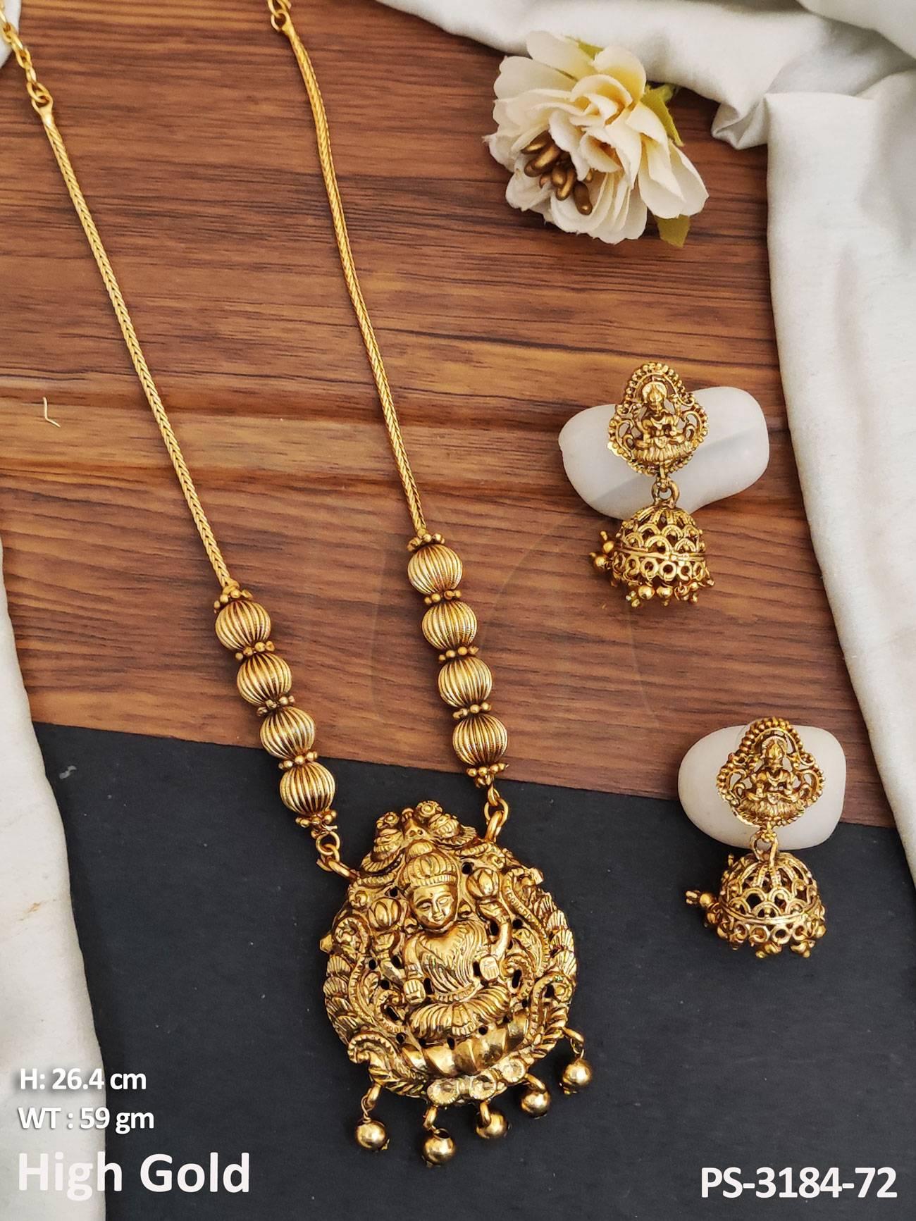 The pendant has an intricate design with a long temple jewellery pattern. Its delicate craftsmanship makes it an eye-catching piece that will stand out.