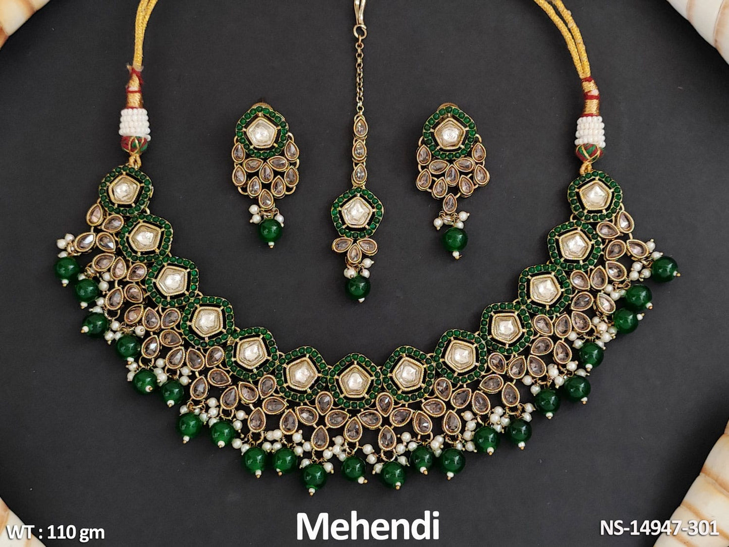 Expertly crafted from brass metal, this Short Necklace Set features an antique design with intricate Mehendi Polish.
